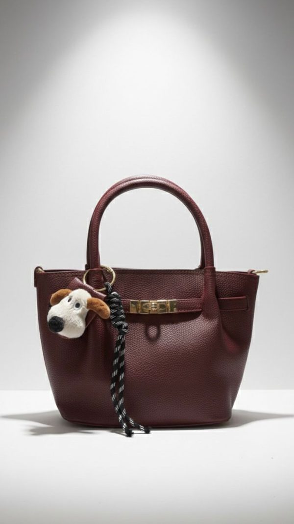 Leather bag with dog bag charm